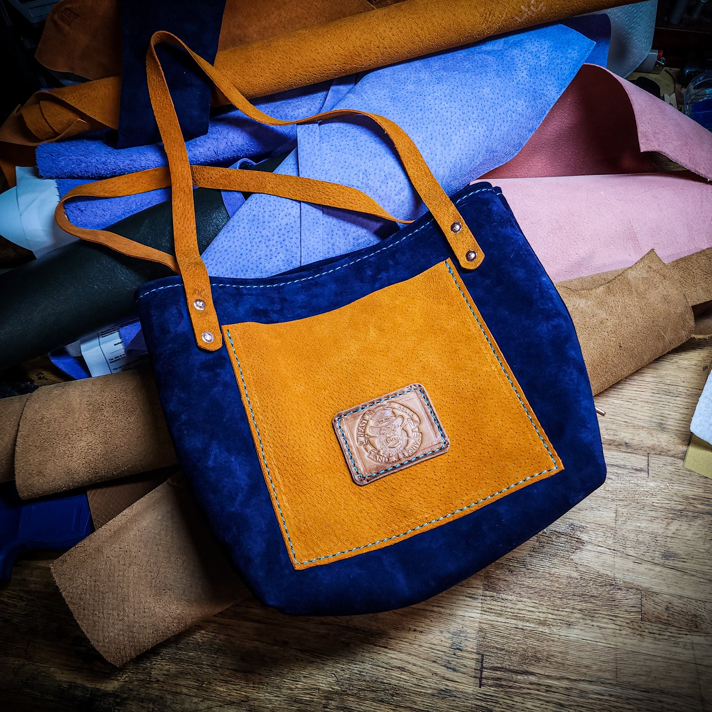 Blue and brown leather tote bag