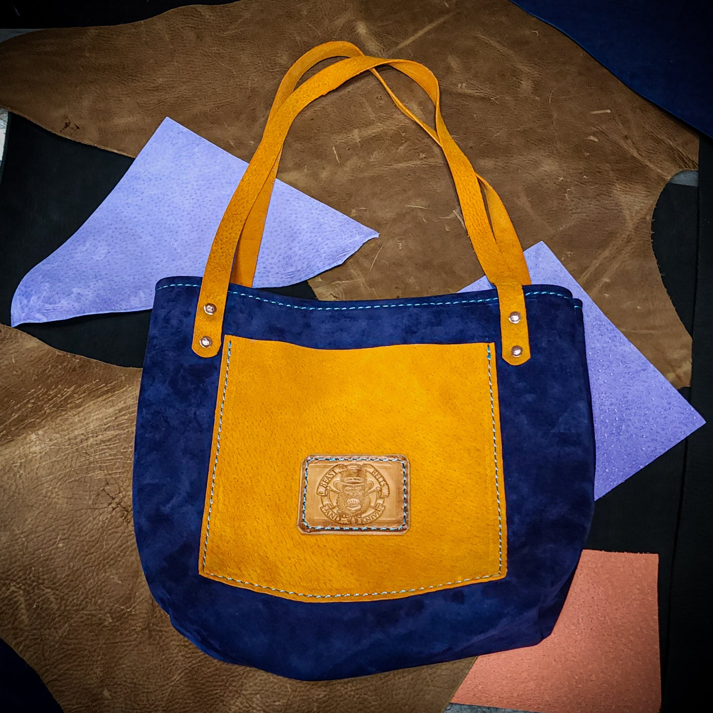 Blue and brown leather tote bag